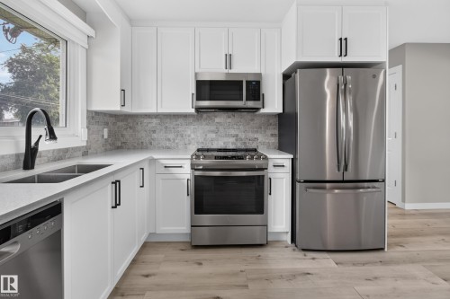 7108 90 Avenue Nw, Edmonton, AB - Indoor Photo Showing Kitchen With Stainless Steel Kitchen With Double Sink With Upgraded Kitchen