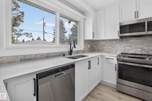 7108 90 Avenue Nw, Edmonton, AB - Indoor Photo Showing Kitchen With Double Sink