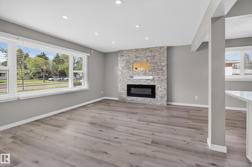 7108 90 Avenue Nw, Edmonton, AB - Indoor Photo Showing Living Room With Fireplace