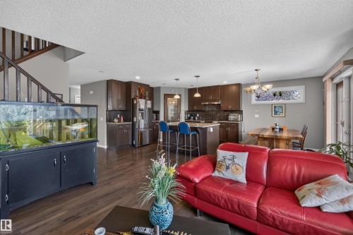 Open-concept living area featuring wood-finish flooring - 16515 139 Street Nw, Edmonton, AB - Indoor Photo Showing Living Room
