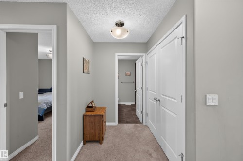 Neutral paint palette and carpeted flooring - 16515 139 Street Nw, Edmonton, AB - Indoor Photo Showing Other Room