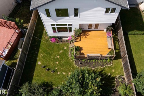 Rear exterior with a spacious wood deck, enclosed by a privacy fence - 16515 139 Street Nw, Edmonton, AB - Outdoor
