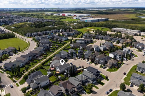 Aerial perspective showcasing the residential neighborhood layout, surrounding green spaces, and established local infrastructure - 16515 139 Street Nw, Edmonton, AB - Outdoor With View