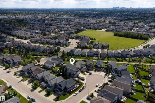 Residential neighborhood with established homes, green spaces, and a city skyline on the horizon - 16515 139 Street Nw, Edmonton, AB - Outdoor With View