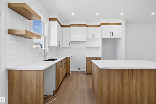523 Robinson Boulevard, Leduc, AB - Indoor Photo Showing Kitchen With Double Sink With Upgraded Kitchen