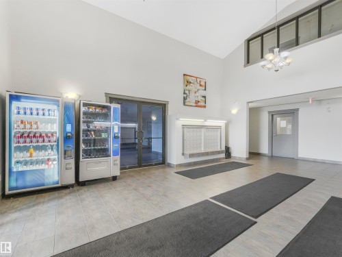 #216 111 Edwards Dr Sw, Edmonton, AB - Indoor With Fireplace