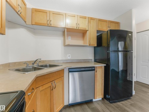 #216 111 Edwards Dr Sw, Edmonton, AB - Indoor Photo Showing Kitchen With Double Sink