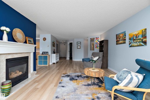 #124 15499 Castle Downs Rd Nw, Edmonton, AB - Indoor Photo Showing Living Room With Fireplace