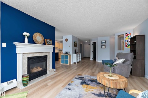#124 15499 Castle Downs Rd Nw, Edmonton, AB - Indoor Photo Showing Living Room With Fireplace