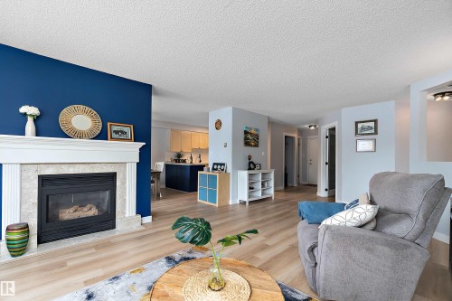 #124 15499 Castle Downs Rd Nw, Edmonton, AB - Indoor Photo Showing Living Room With Fireplace