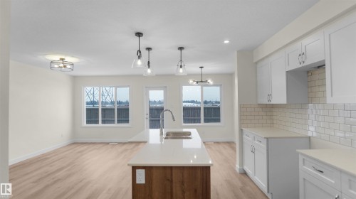 179 Munn Way, Leduc, AB - Indoor Photo Showing Kitchen With Double Sink