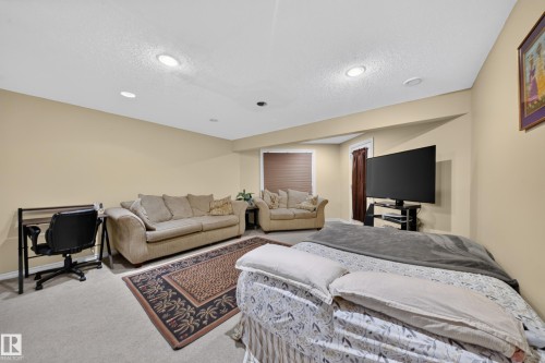 Recessed ceiling lighting, carpeted flooring, and neutral wall tones - 2518 33A Avenue Nw, Edmonton, AB - Indoor