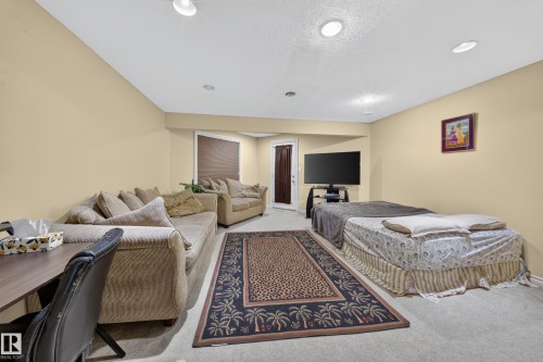 Recessed ceiling lighting, light-toned walls, and a light-toned carpeted floor - 2518 33A Avenue Nw, Edmonton, AB - Indoor