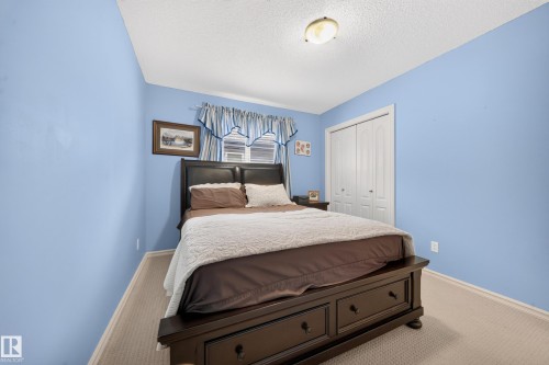 Wall-to-wall carpeting and white trim - 2518 33A Avenue Nw, Edmonton, AB - Indoor Photo Showing Bedroom