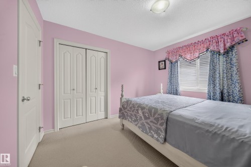 Wall-to-wall carpeting and white trim throughout - 2518 33A Avenue Nw, Edmonton, AB - Indoor Photo Showing Bedroom