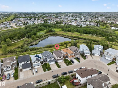 Residential neighborhood with a prominent body of water, surrounded by green spaces and mature trees - 2518 33A Avenue Nw, Edmonton, AB - 