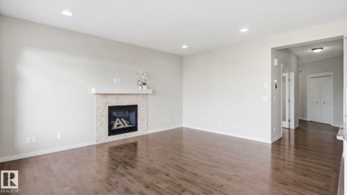 1832 56 Street Sw, Edmonton, AB - Indoor Photo Showing Living Room With Fireplace