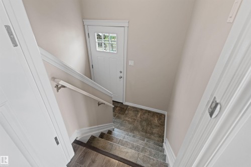 White paneled entry door with clear glass inserts - 10634 155 Street Nw, Edmonton, AB - Indoor Photo Showing Other Room