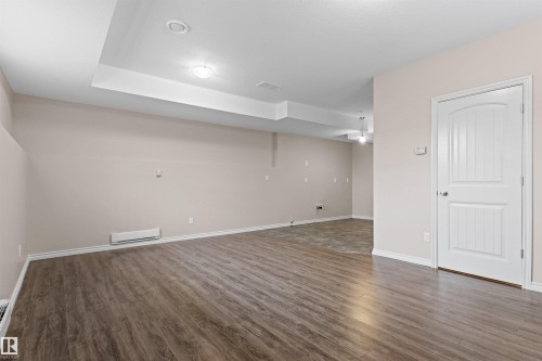 Dual climate control for basement featuring electric baseboard heating in the basement. - 10634 155 Street Nw, Edmonton, AB - Indoor Photo Showing Other Room
