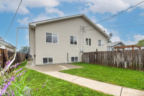 Rear exterior featuring neutral-toned siding - 10634 155 Street Nw, Edmonton, AB - Outdoor With Exterior