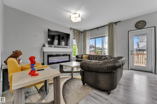 7245 Chivers Place Sw, Edmonton, AB - Indoor Photo Showing Living Room With Fireplace