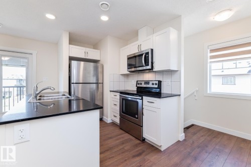 #81 1530 Tamarack Bv Nw, Edmonton, AB - Indoor Photo Showing Kitchen With Stainless Steel Kitchen With Double Sink