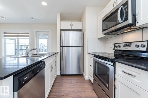 #81 1530 Tamarack Bv Nw, Edmonton, AB - Indoor Photo Showing Kitchen With Stainless Steel Kitchen With Double Sink