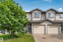 Exterior facade featuring siding, dormer windows, attached garage, and a front entrance with steps - 3769 21 Street Nw, Edmonton, AB  - Outdoor With Facade 