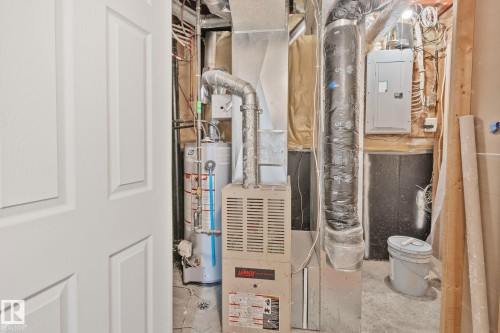 Utility area with furnace, water heater, and electrical panel - 3769 21 Street Nw, Edmonton, AB - Indoor Photo Showing Basement