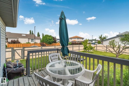 Outdoor wooden deck with dark gray railings - 3769 21 Street Nw, Edmonton, AB - Outdoor With Deck Patio Veranda With Exterior