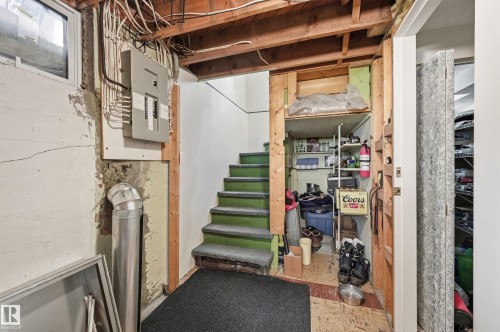 100 AMP Electrical service. Also storage space under stairs. - 10935 127 Street Nw, Edmonton, AB - Indoor Photo Showing Basement