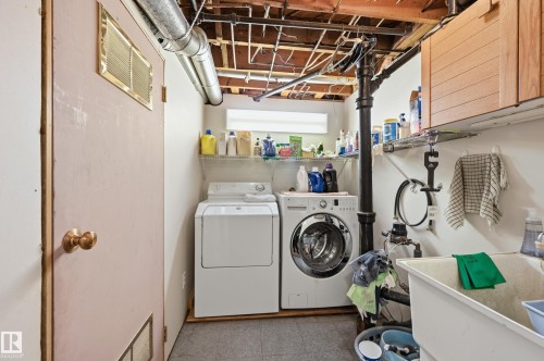 Includes washer and dryer. Also entry to utility room with 2 furnaces and newly installed Hot Water Tank. - 10935 127 Street Nw, Edmonton, AB - Indoor Photo Showing Laundry Room