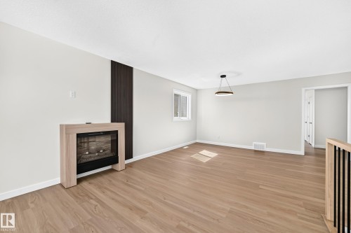 17816 94 Street Nw, Edmonton, AB - Indoor Photo Showing Other Room With Fireplace