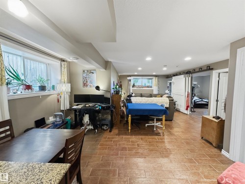 Recessed lighting, wood-finish flooring, and white interior doors - 6515 37 Avenue, Beaumont, AB - Indoor