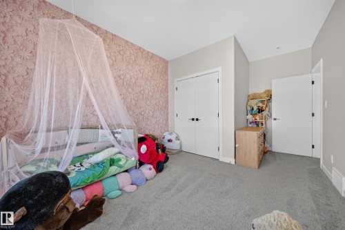 Accent wall with botanical-patterned wallpaper - 4301 38 St, Beaumont, AB - Indoor