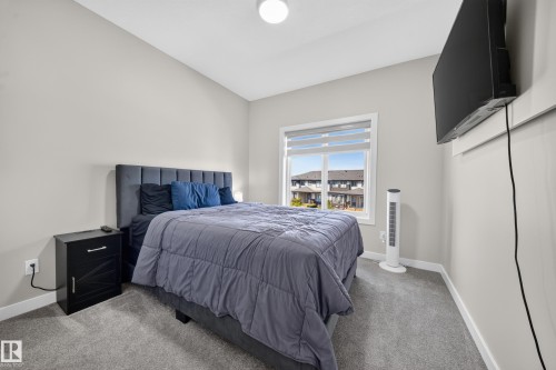 Recessed lighting, wall-to-wall carpeting, and a window with roller blinds - 4301 38 St, Beaumont, AB - Indoor Photo Showing Bedroom