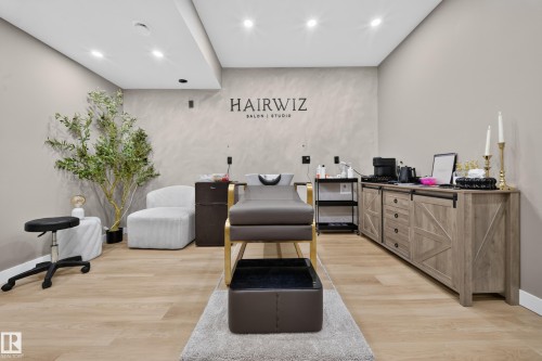 Recessed lighting, wood-finish flooring, and light-toned walls - 4301 38 St, Beaumont, AB - Indoor