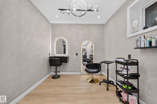 Light wood-finish flooring with smooth wall finishes - 4301 38 St, Beaumont, AB - Indoor