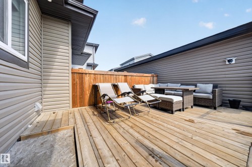 Expansive wood deck with privacy fencing and vinyl siding exterior - 4301 38 St, Beaumont, AB - Outdoor With Deck Patio Veranda With Exterior