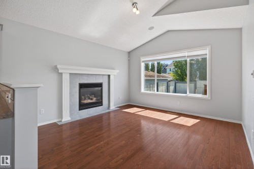 7815 14 Avenue Sw, Edmonton, AB - Indoor Photo Showing Living Room With Fireplace