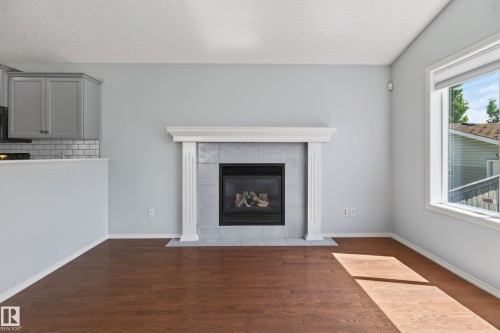7815 14 Avenue Sw, Edmonton, AB - Indoor Photo Showing Living Room With Fireplace