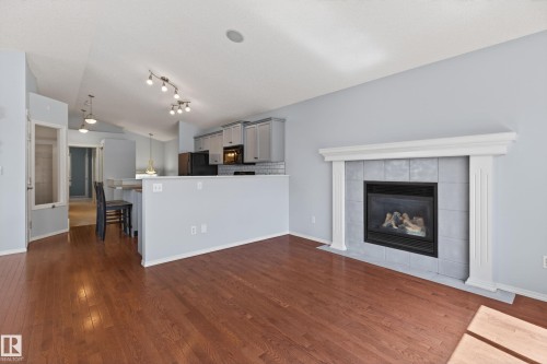 7815 14 Avenue Sw, Edmonton, AB - Indoor Photo Showing Living Room With Fireplace