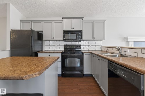 7815 14 Avenue Sw, Edmonton, AB - Indoor Photo Showing Kitchen With Double Sink