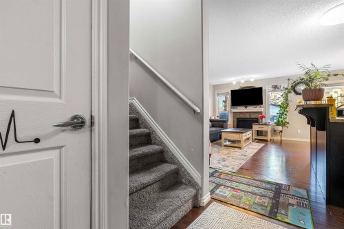 2627 29 Street Nw, Edmonton, AB - Indoor Photo Showing Other Room With Fireplace