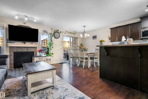 2627 29 Street Nw, Edmonton, AB - Indoor Photo Showing Living Room With Fireplace