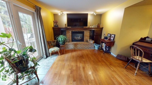 76 Gariepy Crescent Nw, Edmonton, AB - Indoor Photo Showing Other Room With Fireplace