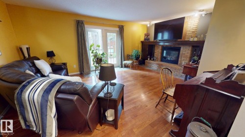 76 Gariepy Crescent Nw, Edmonton, AB - Indoor Photo Showing Other Room With Fireplace