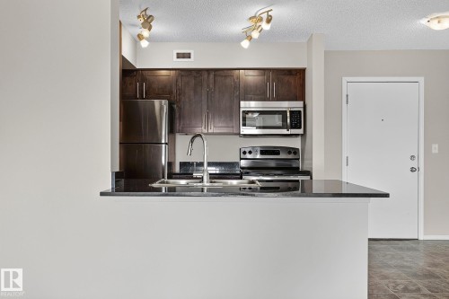 #417 12045 22 Av Sw, Edmonton, AB - Indoor Photo Showing Kitchen With Stainless Steel Kitchen With Double Sink