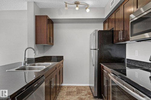 #417 12045 22 Av Sw, Edmonton, AB - Indoor Photo Showing Kitchen With Stainless Steel Kitchen With Double Sink