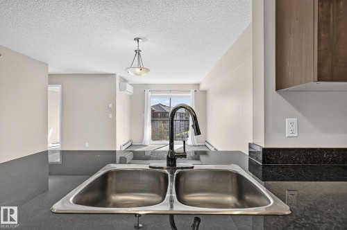 #417 12045 22 Av Sw, Edmonton, AB - Indoor Photo Showing Kitchen With Double Sink